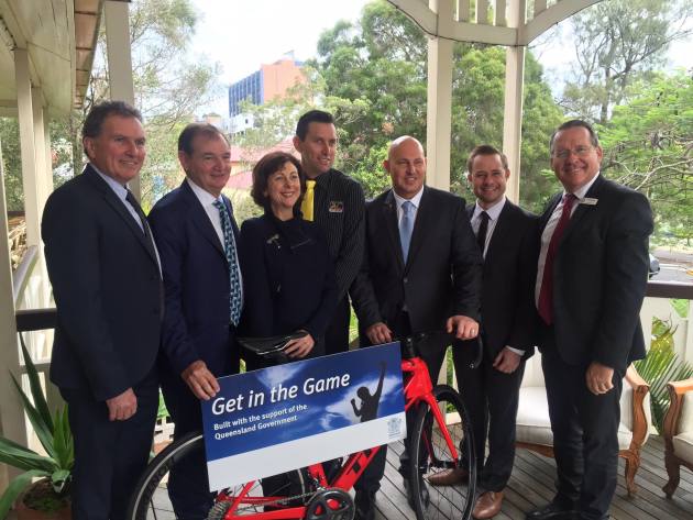 Yellow Jersey bike shop proprietor Troy Dobinson (wearing yellow tie) with state and local government politicians and officials at the Premier&rsquo;s Budget Breakfast announcement last week.